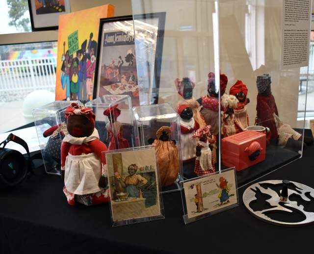 Dolls and other artifacts in the Utah Black History Museum display