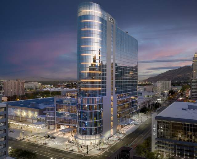 Hyatt Regency hotel attached to the Salt Palace Convention Center and surrounding area at twilight