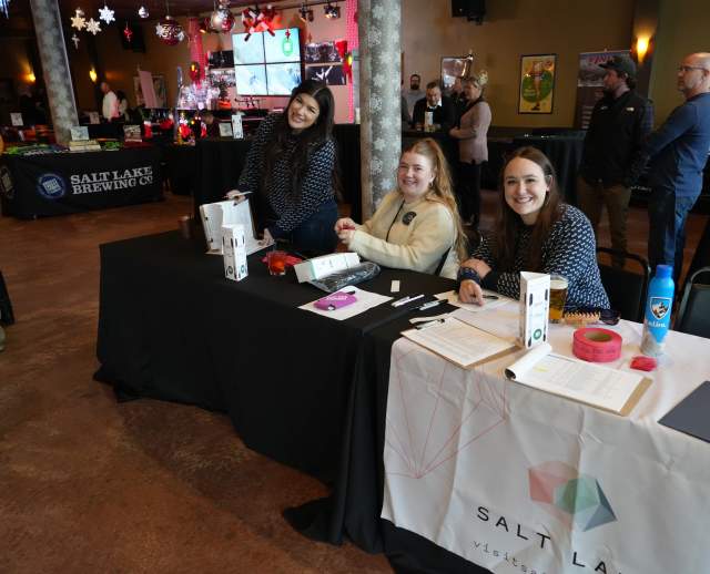 3 ladies sitting at a table smiling