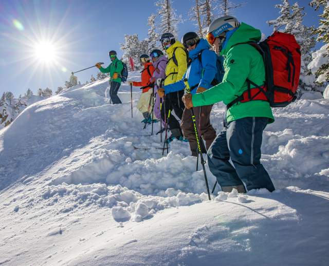 Skiers enjoy a beautiful powder day on the Wasatch Interconnect Tour