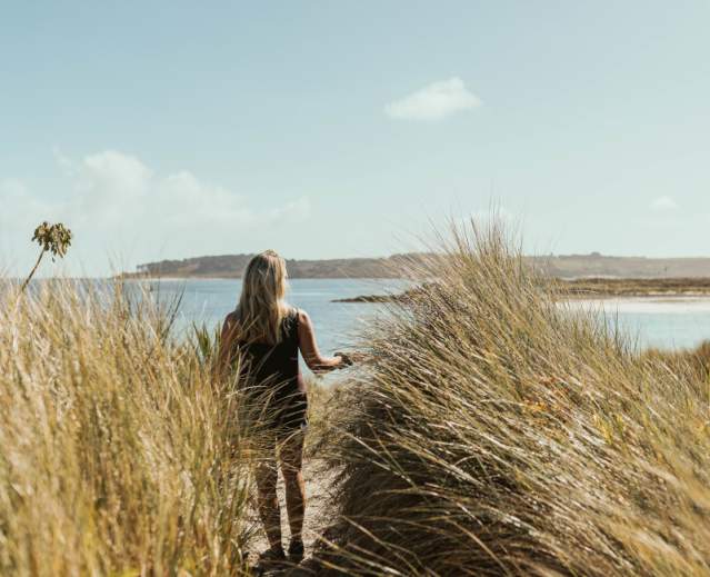 Girl on beach in autumn