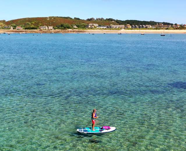 Woman on single paddleboard