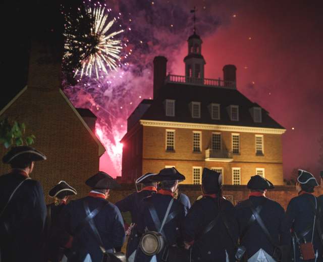 Colonial soldiers watching fireworks go off on the 4th of July