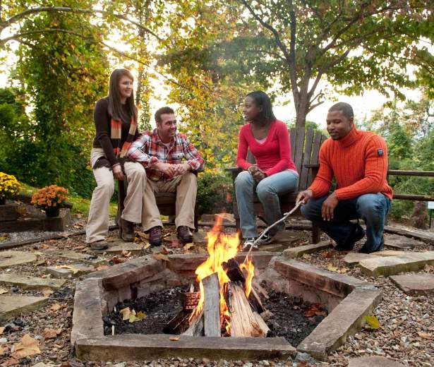 People Sitting Around Fire Pit