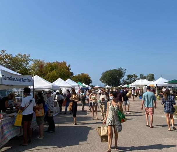 Vendors at a busy Burlington Farmers Market
