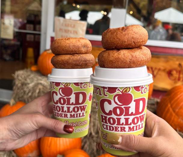 Apple Cider Donuts stacked on top of Hot Apple Cider Cups