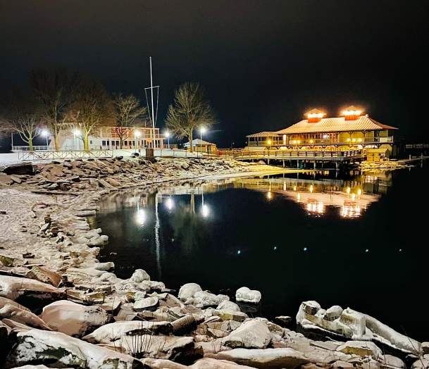 Lake Champlain boathouse on a snowy winter evening