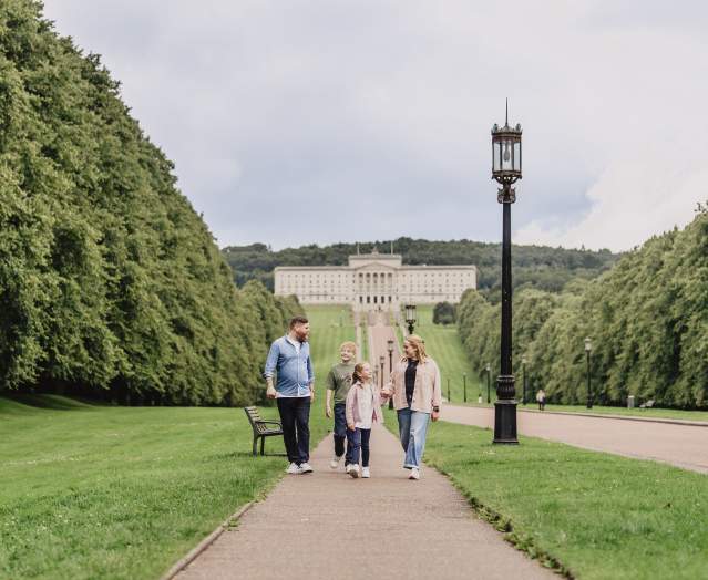 Family walking through Stormont Estate
