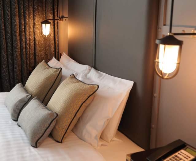 Modern, plush interior of a bedroom in the Titanic Hotel