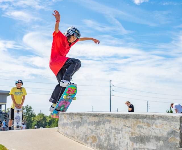 Young child getting air while skateboarding.