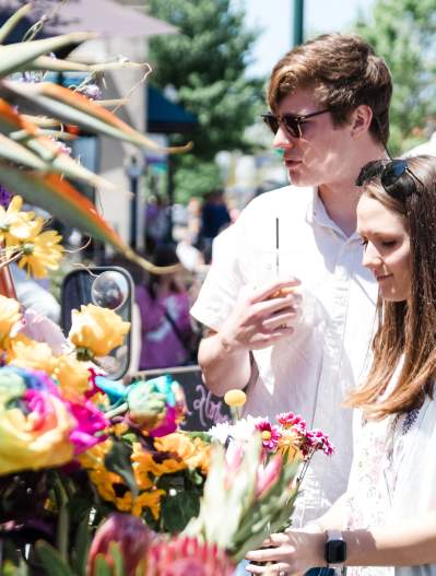 Arts in Bloom couple with flowers