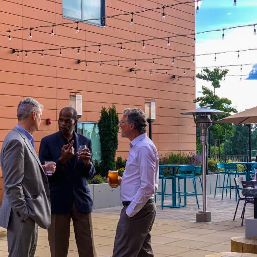 Men on a patio with drinks