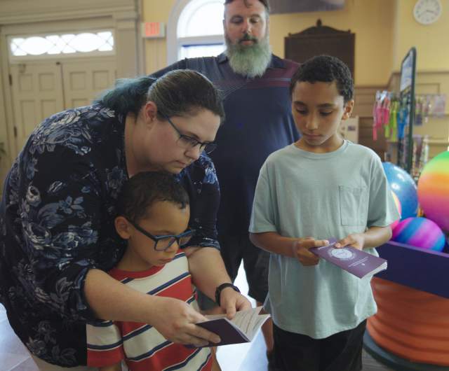 A family of four visit Fayetteville's Fascinate-U Children's Museum with their Cumberland County Destination Passport