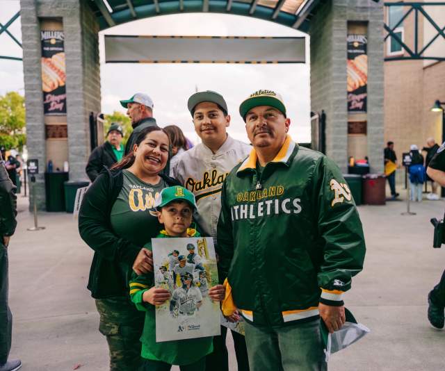 Family of four at an Athletics game in Sacramento