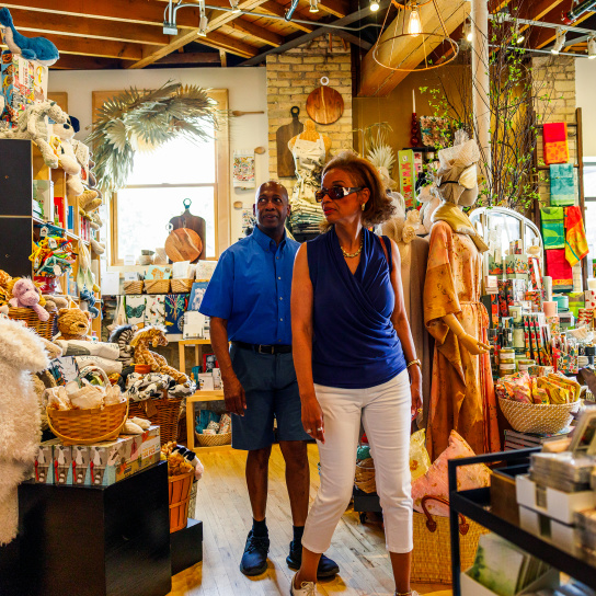 couple looking around store, shopping