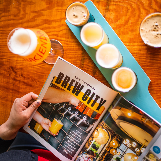 brew city page from official visitor's guide with beer flight