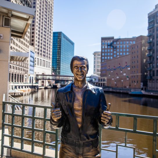 a bronze statue of the Happy Days character The Fonz on the Milwaukee RiverWalk