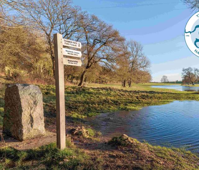 View of the source of the Thames and signpost for Thames Path