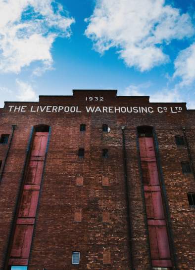 Front of a red brick venue in Manchester