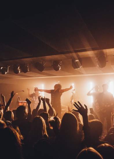 Band performing on stage in front of a crowd