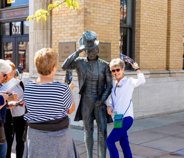 group touring the city of presidents statues found in downtown rapid city, sd