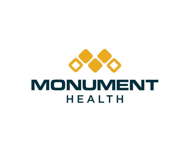 Logo of Monument Health that links to its website.