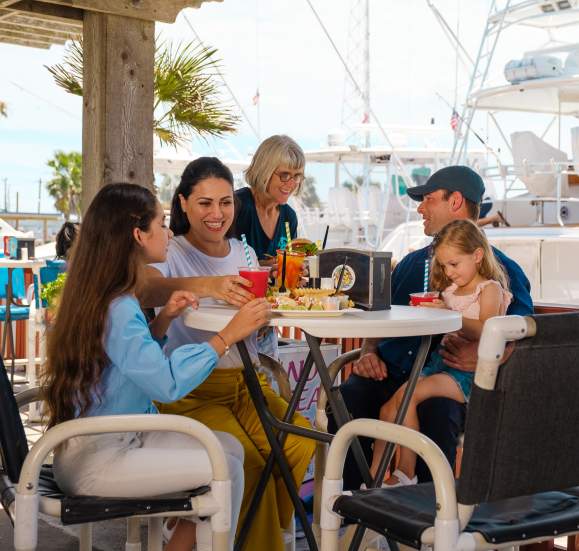 Family dining at Mahi nic by the dockside