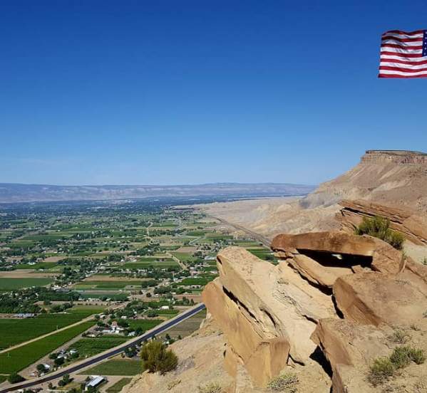 American Flag Waving Above the Grand Junction Area on the Book Cliffs
