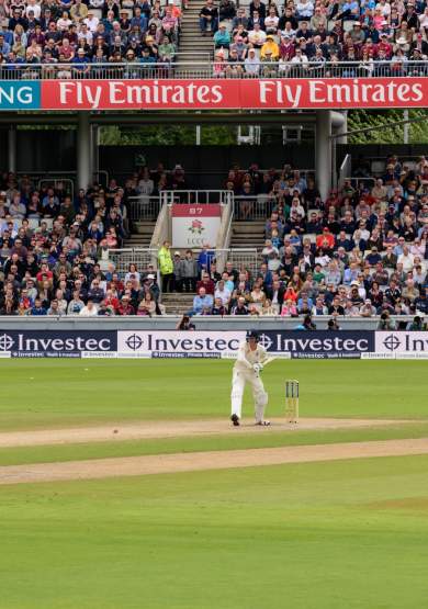 Cricket Match taking place in front of a crowd at Emirates Old Trafford