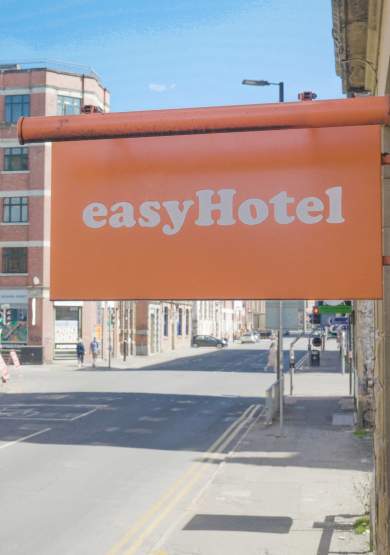 Orange easyHotel sign in Manchester city centre