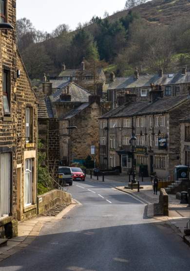 Quaint village street with stone buildings either side