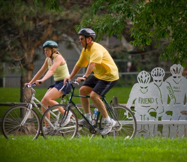 People Riding Bikes Through Omaha Park