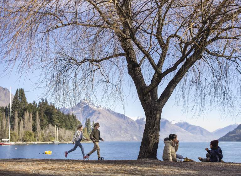 Family enjoying themselves on Queenstown Beach in spring