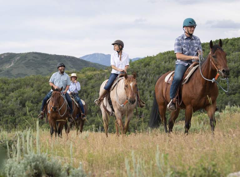 A group of people horseback riding
