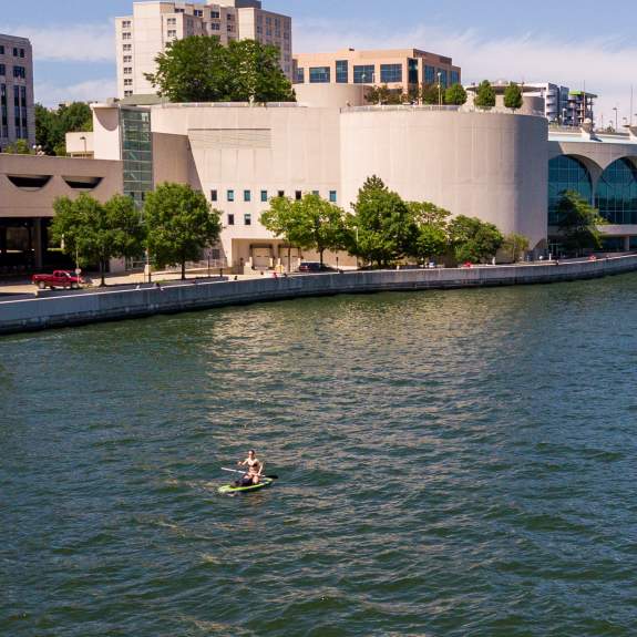 Paddlers on Lake Monona, looking at the Monona Terrace in Madison, WI