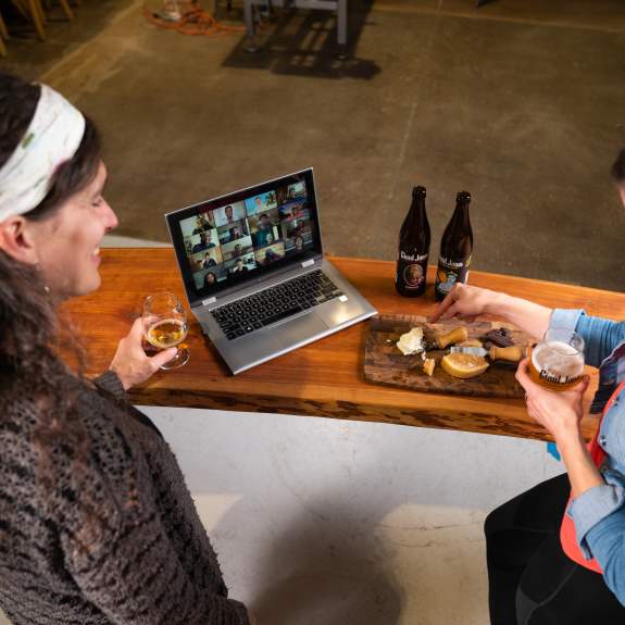 Two women host a virtual beer and cheese tasting