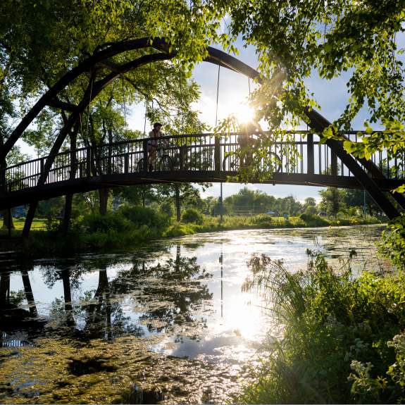 An image of the bridge that goes over the Yahara River at Tenney Park.
