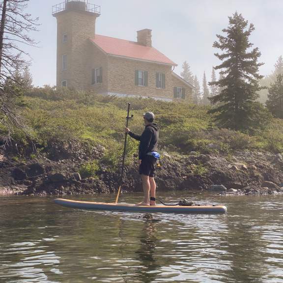 SUP near the Copper Harbor Lighthouse on a foggy afternoon