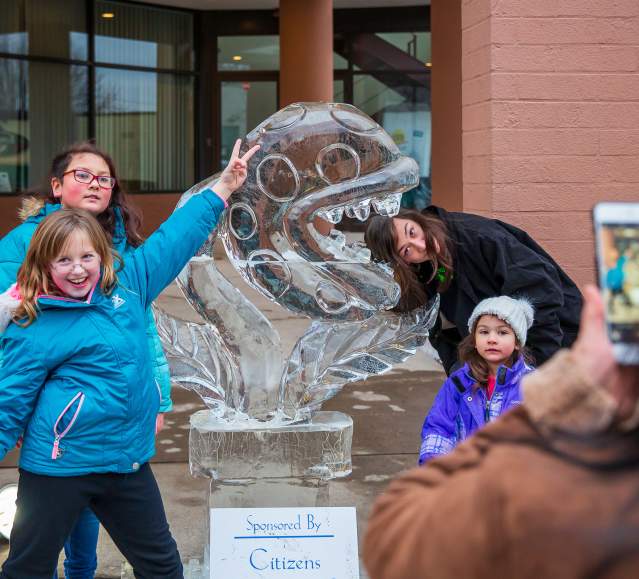 People posing for pics in front of sculptures at the Clarks Summit Festival of Ice