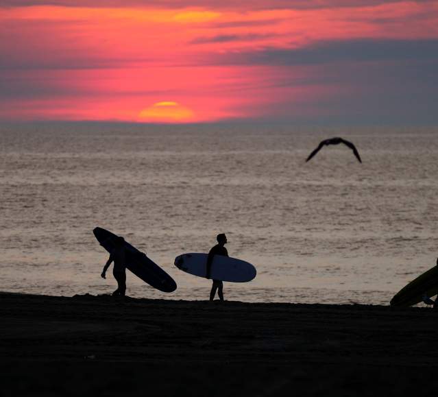 Surfing at Sunrise in Ocean City, MD