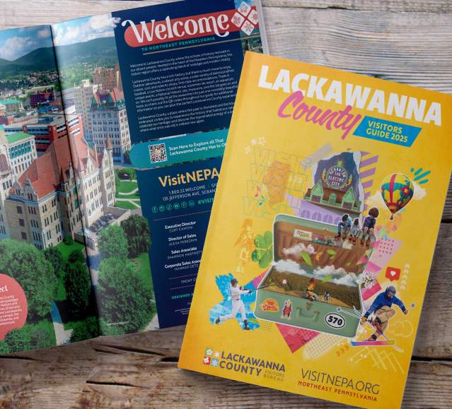 front cover and open pages of the 2025 Lackawanna County Visitors Guide