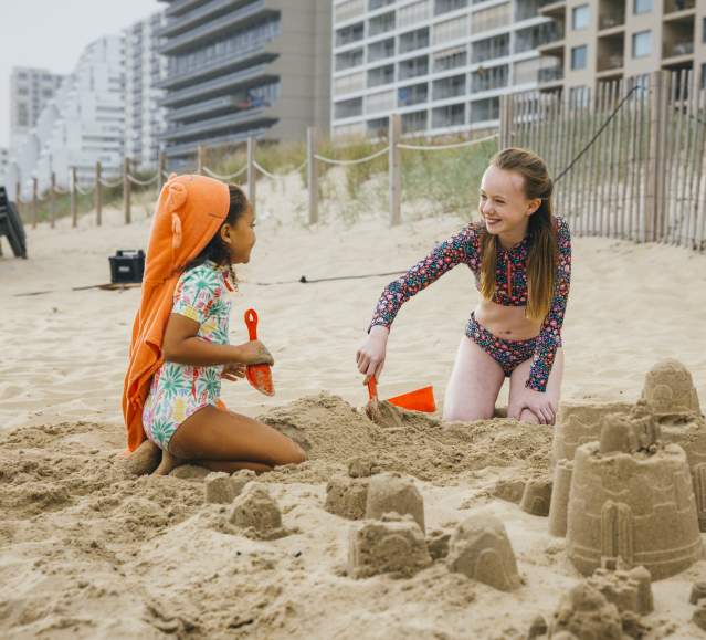 Kids on Beach Building Sandcastles