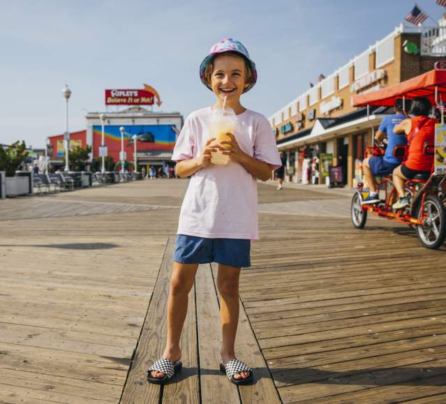 Child on Boardwalk with Ice Cream