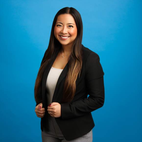 Aaliyah Phounsavath headshot on blue background