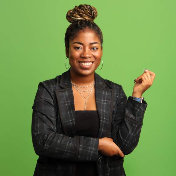 D'Sha Edge headshot on green background