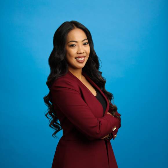 Sheila Lyles headshot on blue background