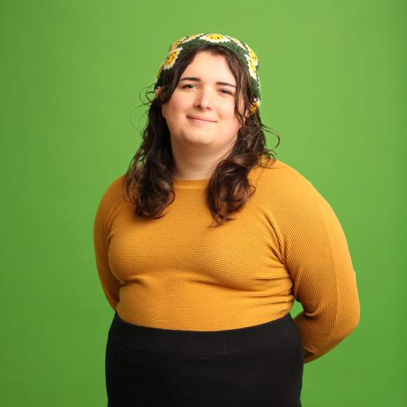 Evelyn McBride headshot on green background