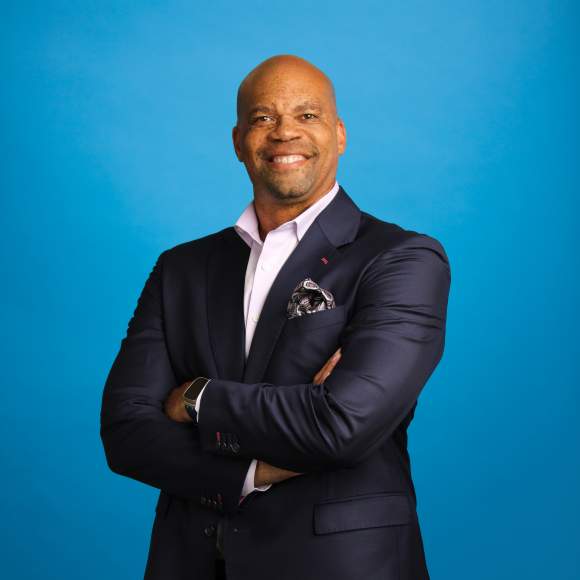 Bill Adams' headshot on blue background