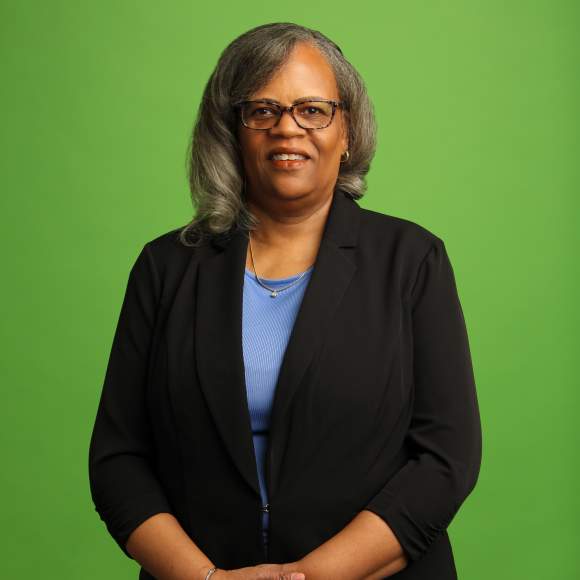 Renee' Scott's headshot on green background