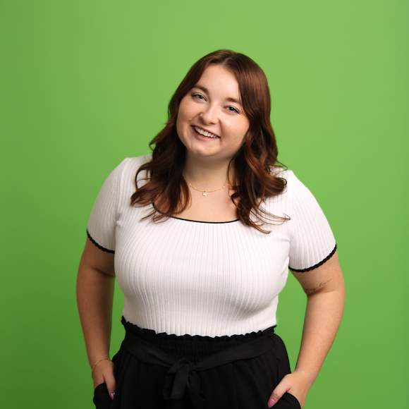 Lindsey Wolfe headshot on mint green background